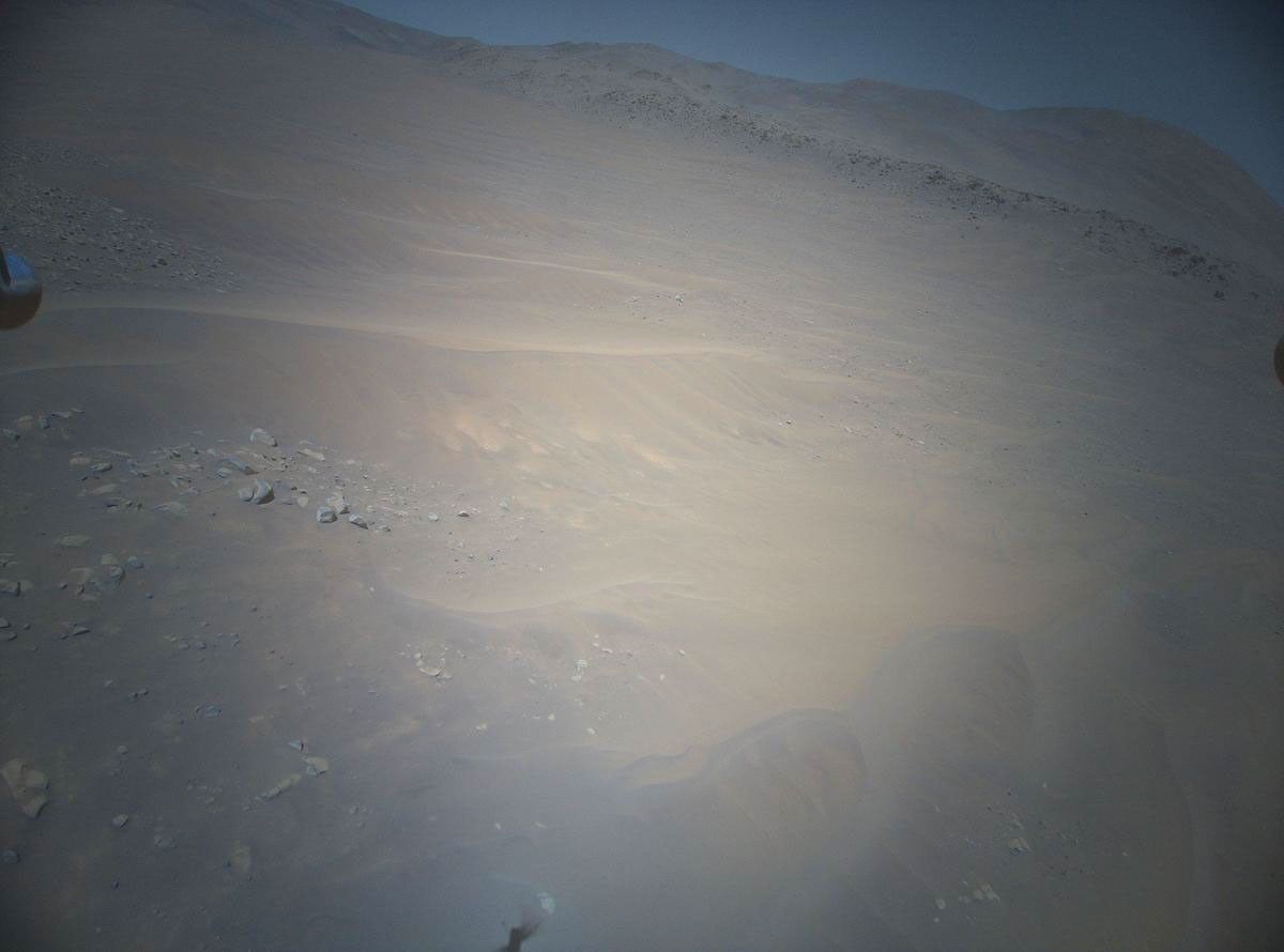 NASA's Ingenuity Mars Helicopter acquired this image using its high-resolution color camera. This camera is mounted in the helicopter's fuselage and pointed approximately 22 degrees below the horizon.