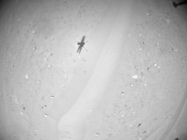 NASA's Ingenuity Mars Helicopter acquired this image using its navigation camera. This camera is mounted in the helicopter's fuselage and pointed directly downward to track the ground during flight.
