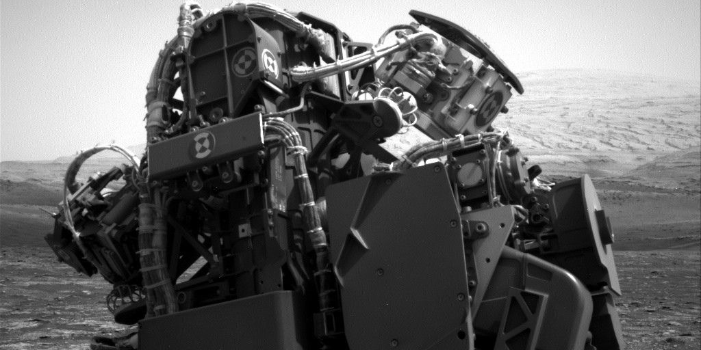Curiosity’s turret and Mount Sharp is in the background