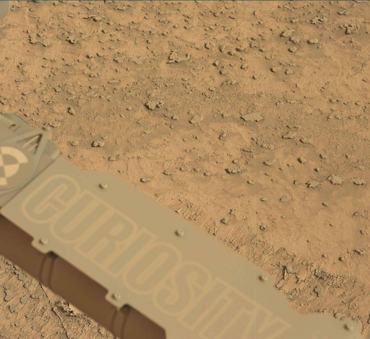 This image showing the Curiosity rover's nameplate was taken by Mast Camera (Mastcam) onboard NASA's Mars rover Curiosity on Sol 3708.