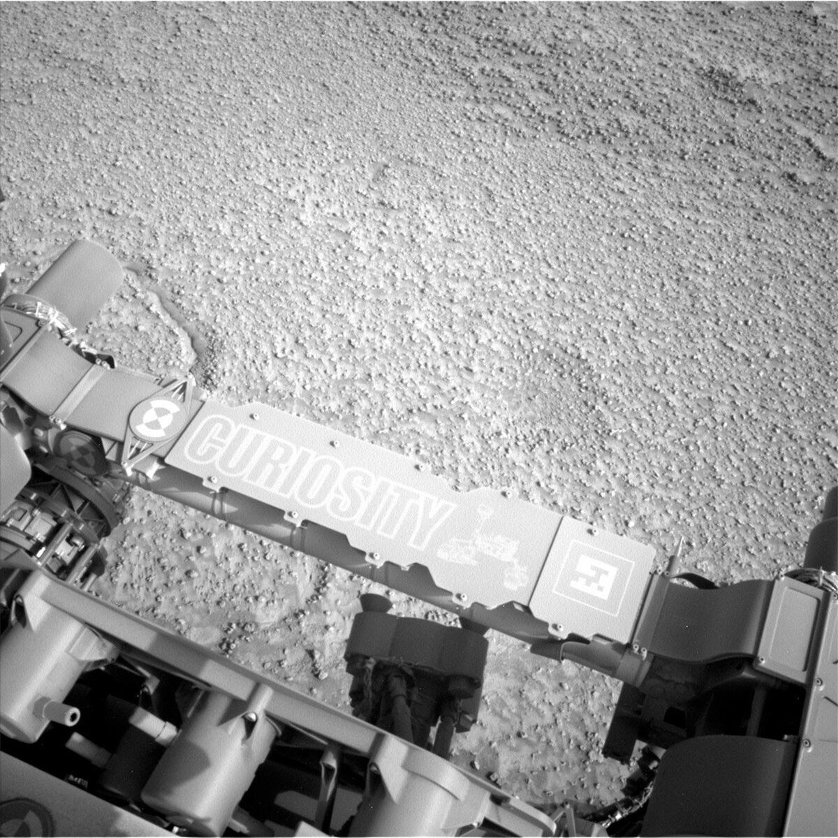 This image showing Curiosity's nameplate and the Mars surface was taken by Left Navigation Camera onboard the Curiosity rover on Sol 3728.