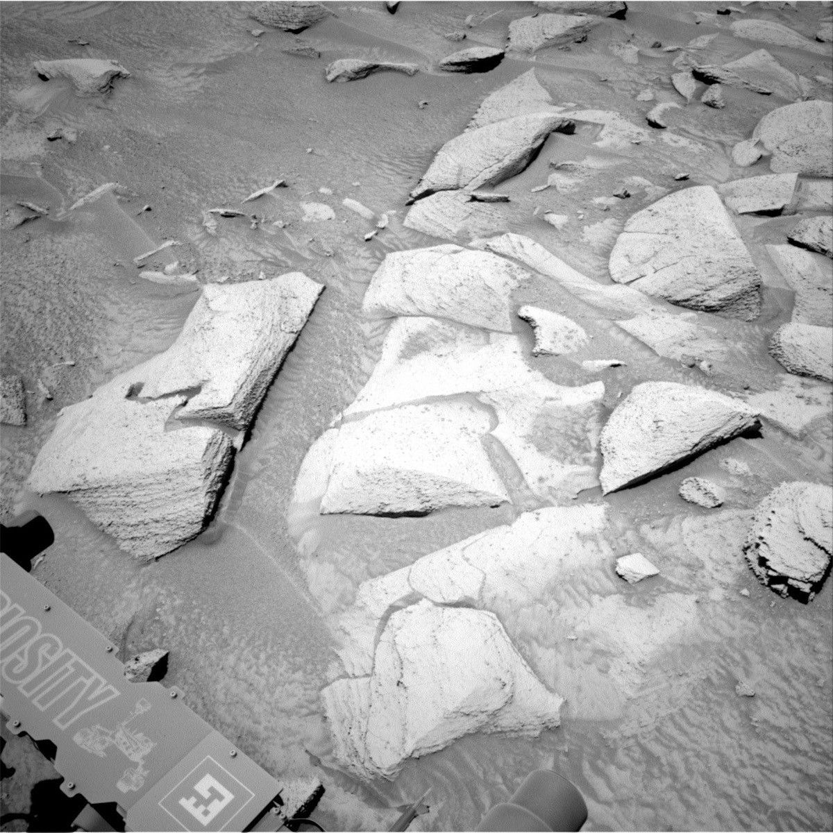 This image of Mars rocks and part of the Curiosity rover was taken by Right Navigation Camera onboard Curiosity on Sol 3817.