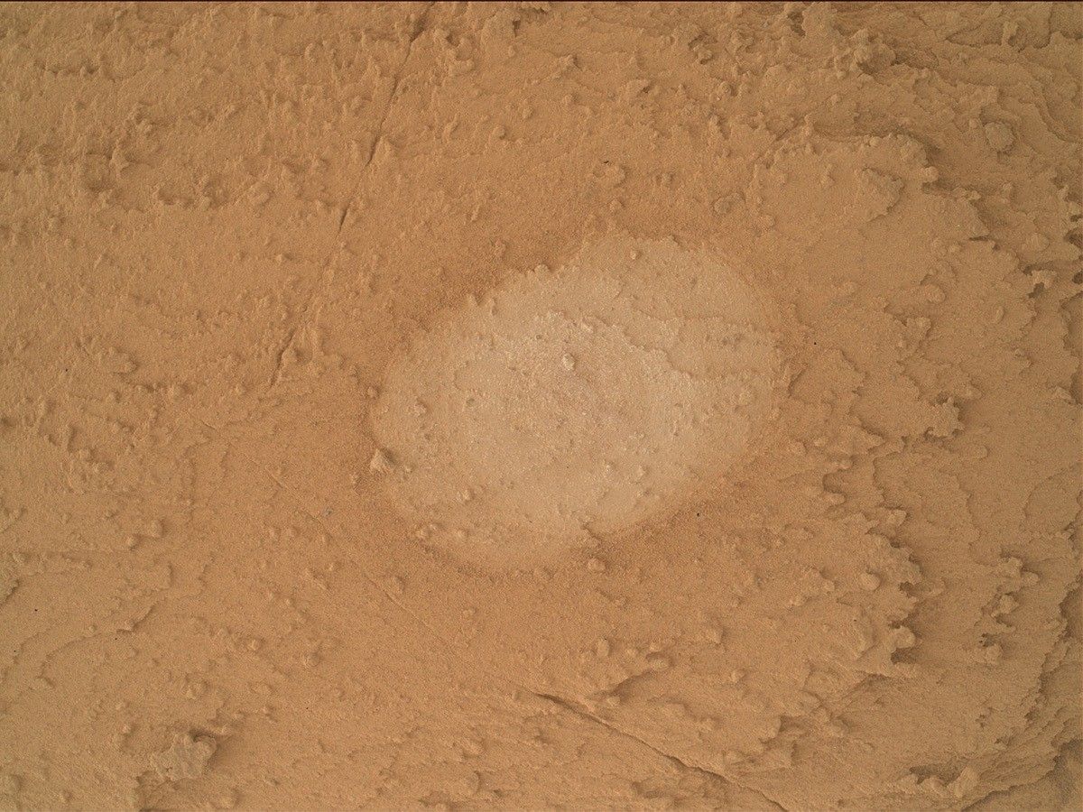 This is a MAHLI image of the brushed, flat and oval-shaped Ubajara potential drill target taken on sol 3819.