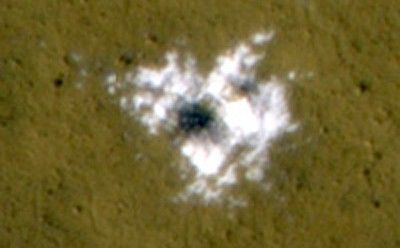 Material Excavated by a Fresh Impact and Identified as Water Ice