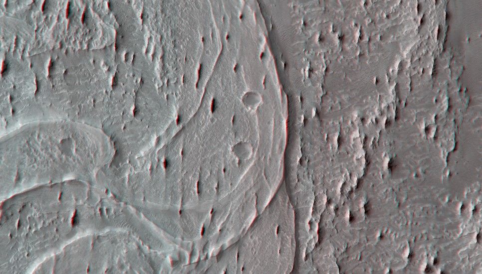 The smaller, narrow ridges oriented vertically are yardangs