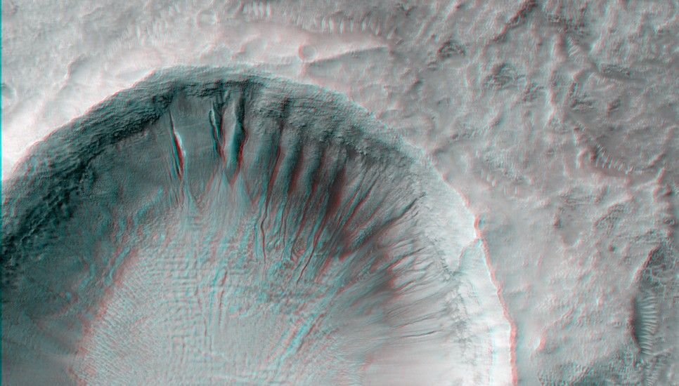 This impact crater has gullies incised into its walls on the north and eastern sides.