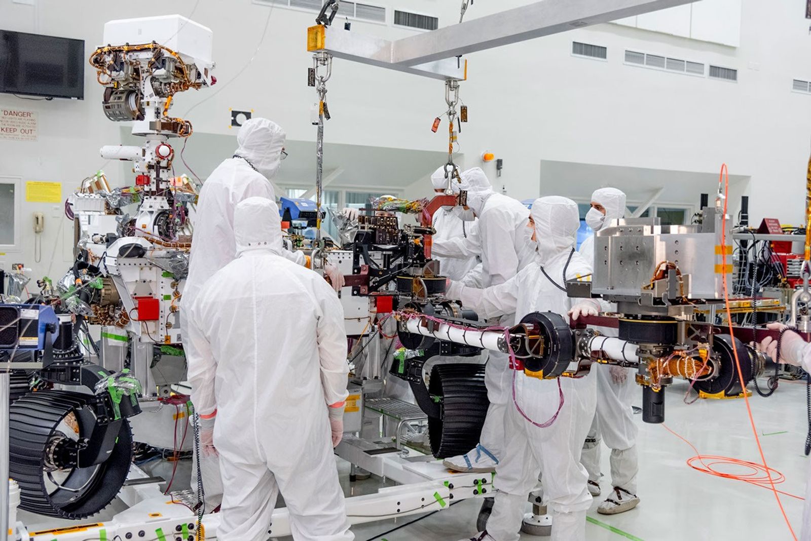 On June 21, 2019, engineers at NASA's Jet Propulsion Laboratory install the main robotic arm on the Mars 2020 rover.