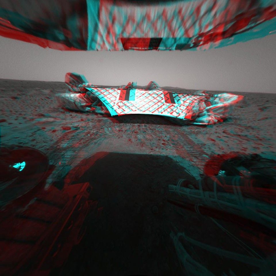 This image from the Mars Exploration Rover Spirit's rear hazard identification camera shows the rover's hind view of the lander platform, its nest for the past 12 sols