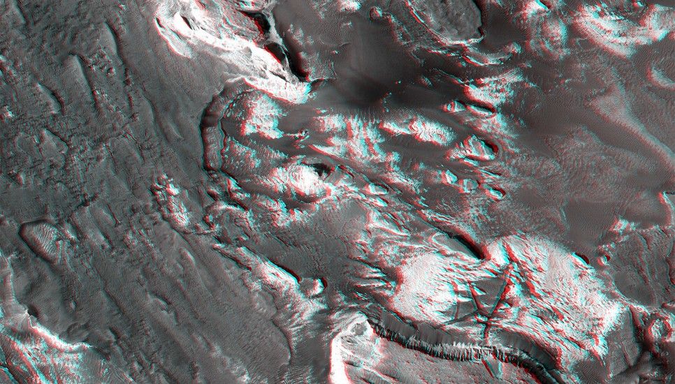 Aram Chaos is a heavily eroded impact crater that contains jumbled blocks of material disrupted when large quantities of ice or water were catastrophically removed.