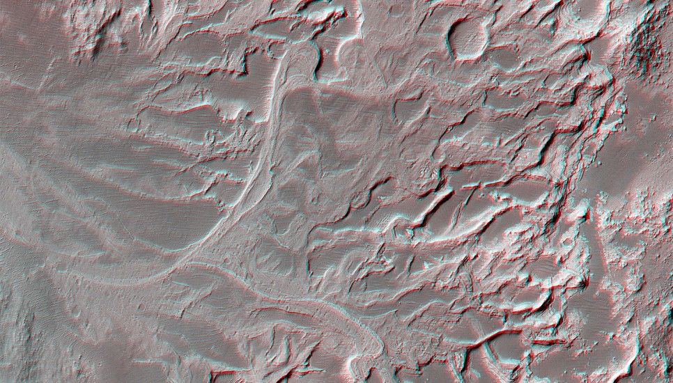 A channel leads into the crater and the lithified remains of a delta, a fan-like feature formed when sediment-laden water flows from a river into a larger body of water such as a lake.