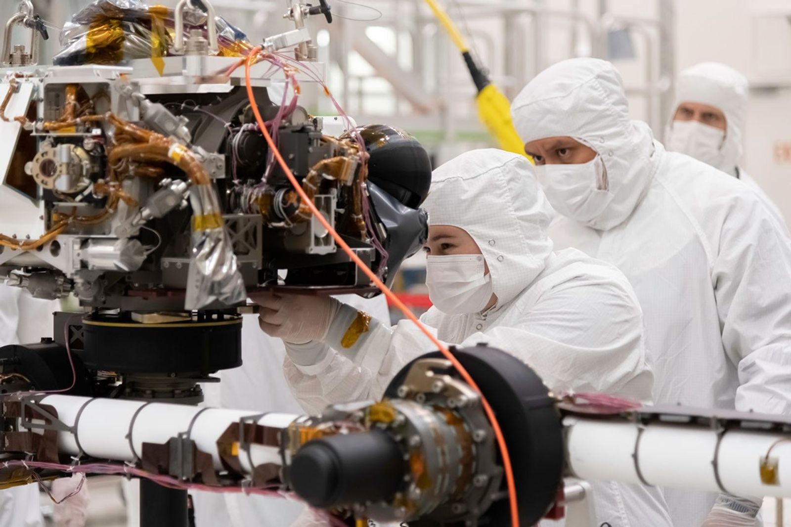 Engineers at JPL install a sensor-filled turret on the end of the rover's seven-foot-long (2.1-meter-long) robotic arm. The image was taken on July 11, 2019.