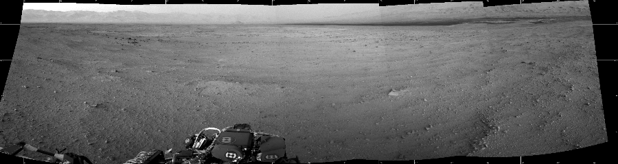 NASA's Mars rover Curiosity took 5 images in Gale Crater using its mast-mounted Left Navigation Camera (Navcam) to create this mosaic. The seam-corrected mosaic provides a 174-degree cylindrical projection panorama of the Martian surface centered at 80 degrees azimuth (measured clockwise from north). Curiosity took the images on September 22, 2012, Sol 45 of the Mars Science Laboratory mission at drive 2100, site number 4. The local mean solar time for the image exposures was 5 PM. Each Navcam image has a 45 degree field of view. CREDIT: NASA/JPL-Caltech