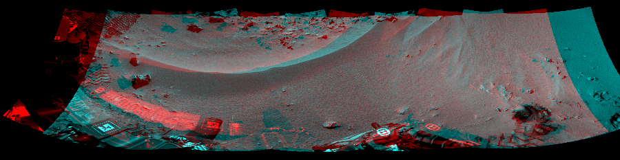 NASA's Mars rover Curiosity took 5 image pairs in Gale Crater using its mast-mounted Navigation Camera (Navcam) to create this mosaic. The seam-corrected mosaic provides a 214-degree cylindrical perspective projection panorama of the Martian surface suitable for stereo viewing, centered at 27 degrees azimuth (measured clockwise from north). This anaglyph must be viewed with red/blue glasses (red over left eye).  Curiosity took the images on October 03, 2012, Sol 56 of the Mars Science Laboratory mission at drive 3474, site number 4. The local mean solar time for the image exposures was 2 PM. Each Navcam image has a 45-degree field of view. CREDIT: NASA/JPL-Caltech