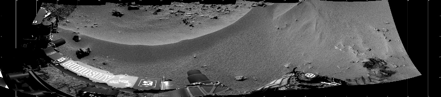 NASA's Mars rover Curiosity took 5 images in Gale Crater using its mast-mounted Left Navigation Camera (Navcam) to create this mosaic. The seam-corrected mosaic provides a 214-degree cylindrical projection panorama of the Martian surface centered at 309 degrees azimuth (measured clockwise from north). Curiosity took the images on October 03, 2012, Sol 56 of the Mars Science Laboratory mission at drive 3474, site number 4. The local mean solar time for the image exposures was 2 PM. Each Navcam image has a 45 degree field of view. CREDIT: NASA/JPL-Caltech