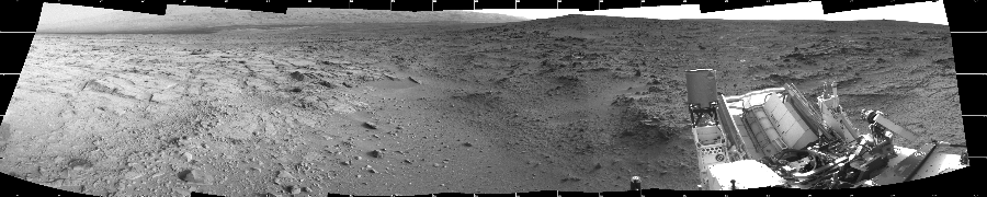 NASA's Mars rover Curiosity took 7 images in Gale Crater using its mast-mounted Left Navigation Camera (Navcam) to create this mosaic. The seam-corrected mosaic provides a 237-degree cylindrical projection panorama of the Martian surface centered at 195 degrees azimuth (measured clockwise from north). Curiosity took the images on November 30, 2012, Sol 113 of the Mars Science Laboratory mission at drive 432, site number 5. The local mean solar time for the image exposures was 4 PM. Each Navcam image has a 45 degree field of view. CREDIT: NASA/JPL-Caltech