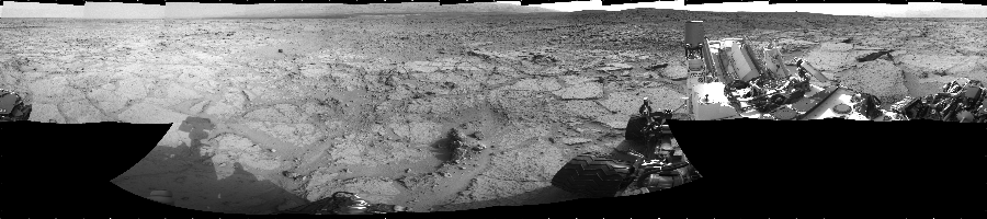 NASA's Mars rover Curiosity took 17 images in Gale Crater using its mast-mounted Left Navigation Camera (Navcam) to create this mosaic. The seam-corrected mosaic provides a 360-degree cylindrical projection panorama of the Martian surface centered at 180 degrees azimuth (measured clockwise from north). Curiosity took the images on December 10, 2012, Sol 122 of the Mars Science Laboratory mission at drive 938, site number 5. The local mean solar time for the image exposures was 3 PM. Each Navcam image has a 45 degree field of view. CREDIT: NASA/JPL-Caltech