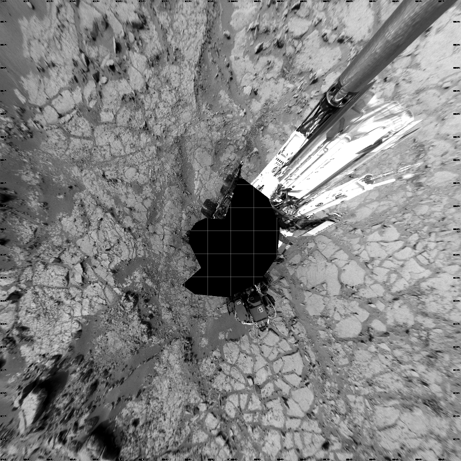 NASA's Mars rover Curiosity took 17 images in Gale Crater using its mast-mounted Left Navigation Camera (Navcam) to create this mosaic. The seam-corrected mosaic provides a vertical projection of the Martian surface near the rover, covering an area of 20 meters (north/south) by 20 meters (east/west). North is up in the image. This projection provides an overhead view, but introduces distortion for items not on the surface, such as large rocks and the rover itself. Curiosity took the images on December 21, 2012, Sol 133 of the Mars Science Laboratory mission at drive 1858, site number 5. The local mean solar time for the image exposures was from 2 PM to 3 PM. Each Navcam image has a 45-degree field of view. CREDIT: NASA/JPL-Caltech