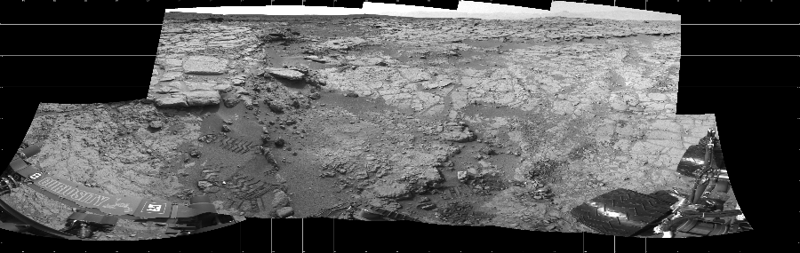 NASA's Mars rover Curiosity took 11 images in Gale Crater using its mast-mounted Left Navigation Camera (Navcam) to create this mosaic. The seam-corrected mosaic provides a 256-degree cylindrical projection panorama of the Martian surface centered at 291 degrees azimuth (measured clockwise from north). Curiosity took the images on January 17, 2013, Sol 159 of the Mars Science Laboratory mission at drive 1986, site number 5. The local mean solar time for the image exposures was 2 PM. Each Navcam image has a 45 degree field of view. CREDIT: NASA/JPL-Caltech