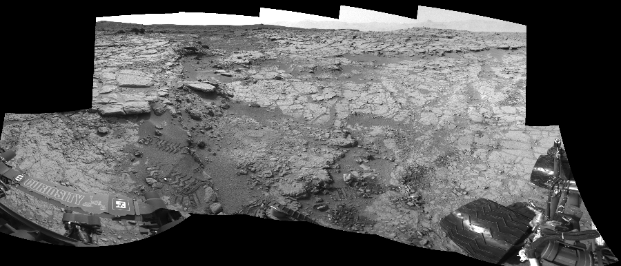 NASA's Mars rover Curiosity took 11 images in Gale Crater using its mast-mounted Left Navigation Camera (Navcam) to create this mosaic. The seam-corrected mosaic provides a 237-degree cylindrical-perspective projection panorama of the Martian surface suitable for stereo viewing, centered at 74 degrees azimuth (measured clockwise from north). This single-eye view must be combined with the partner right image to be viewed in stereo.  Curiosity took the images on January 17, 2013, Sol 159 of the Mars Science Laboratory mission at drive 1986, site number 5. The local mean solar time for the image exposures was 2 PM. Each Navcam image has a 45-degree field of view. CREDIT: NASA/JPL-Caltech