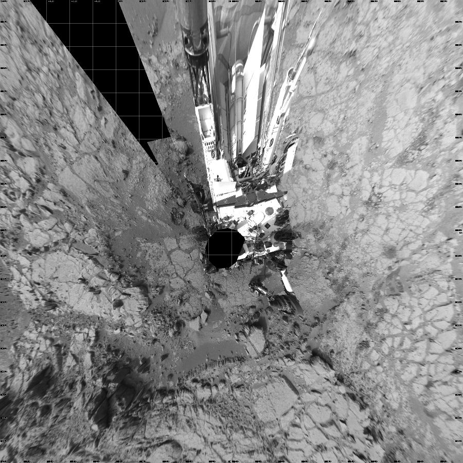 NASA's Mars rover Curiosity took 39 images in Gale Crater using its mast-mounted Left Navigation Camera (Navcam) to create this mosaic. The seam-corrected mosaic provides a vertical projection of the Martian surface near the rover, covering an area of 20 meters (north/south) by 20 meters (east/west). North is up in the image. This projection provides an overhead view, but introduces distortion for items not on the surface, such as large rocks and the rover itself.  Curiosity took the images on January 26, 2013, Sols 168-169 of the Mars Science Laboratory mission at drive 0, site number 6. The local mean solar time for the image exposures was from 3 PM to 4 PM. Each Navcam image has a 45-degree field of view. CREDIT: NASA/JPL-Caltech
