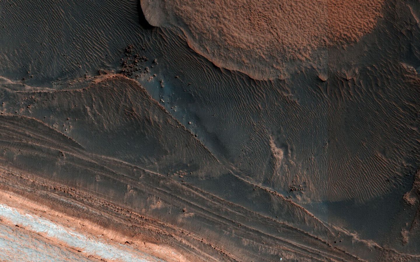 Ice block avalanche. This image from NASA's Mars Reconnaissance Orbiter shows many new ice blocks compared to earlier images in 2006.