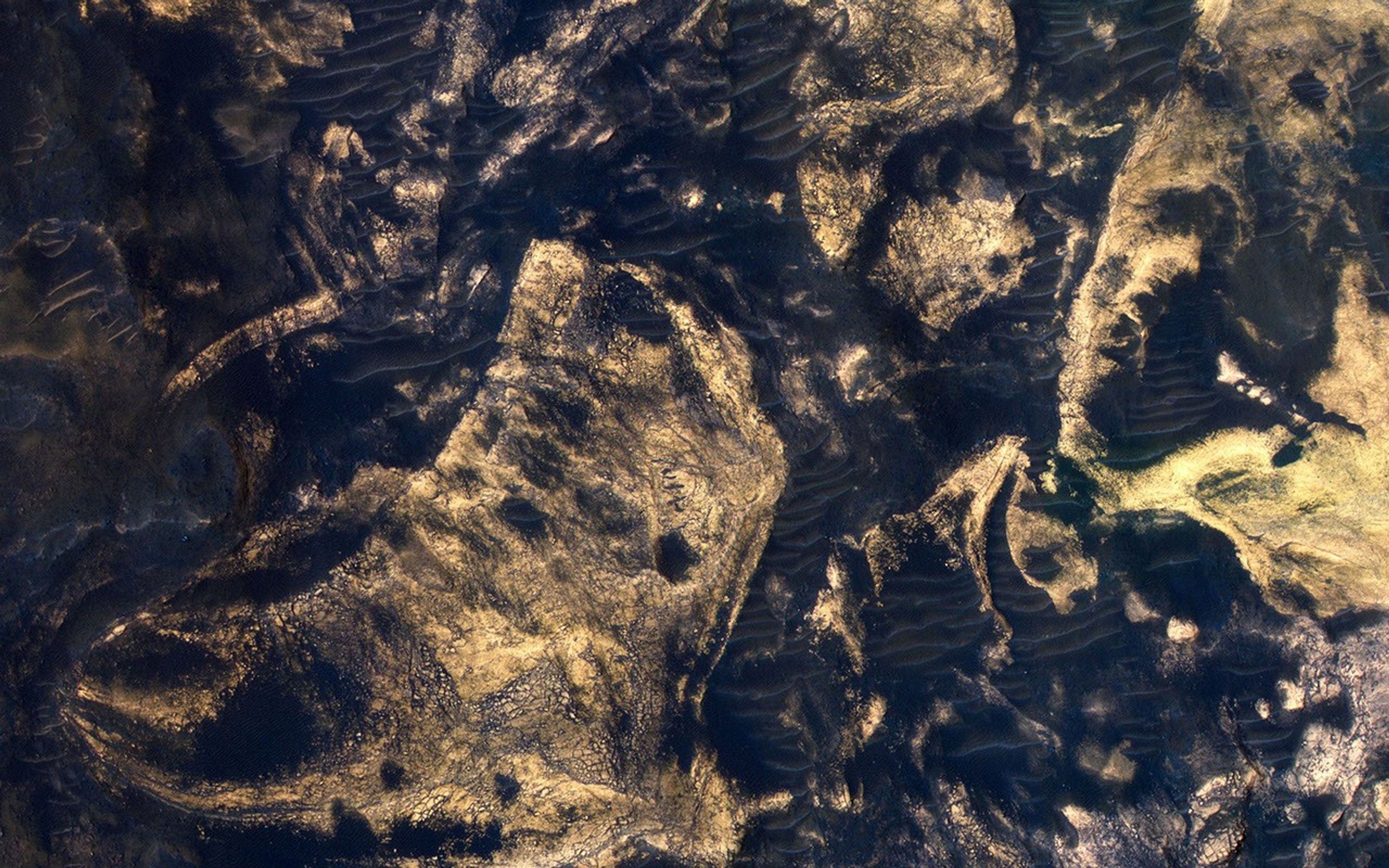 This image acquired on January 20, 2019 by NASAs Mars Reconnaissance Orbiter, shows a chaotic jumble of bright layered sediments, perhaps resulting from large landslides.