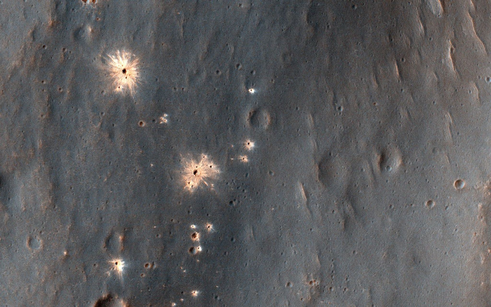 This image acquired on December 9, 2018 by NASAs Mars Reconnaissance Orbiter, shows a recent impact in Noachis Terra in the southern mid-latitudes of Mars.