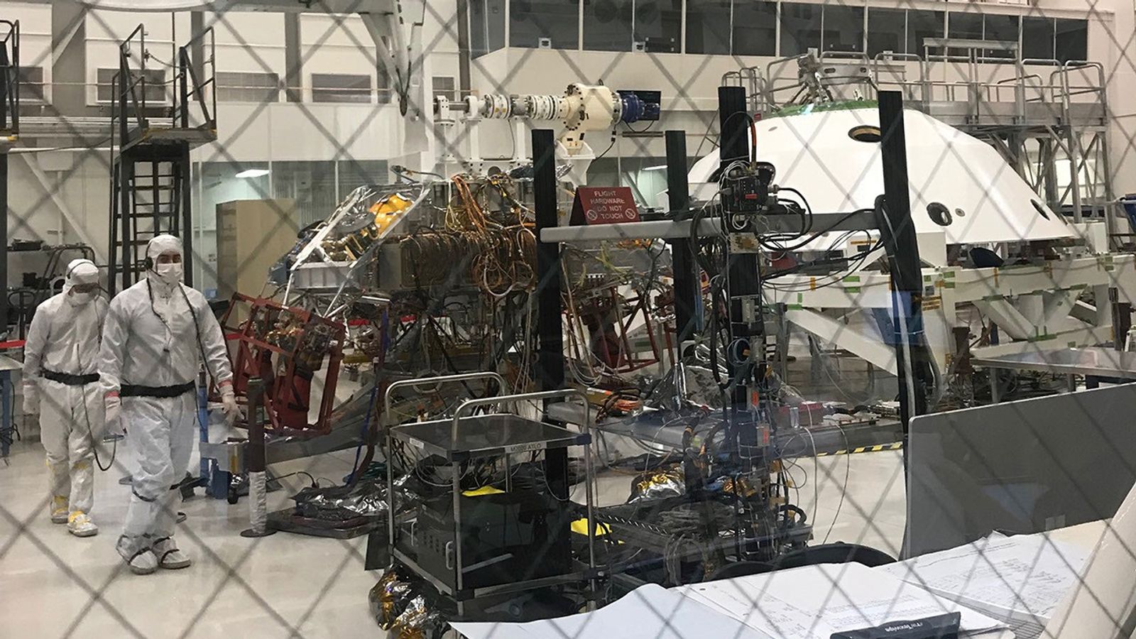 Technicians working Mars 2020’s System’s Test 1 approach their workstation in the Spacecraft Assembly Facility at NASA’s Jet Propulsion Laboratory in Pasadena, Calif.