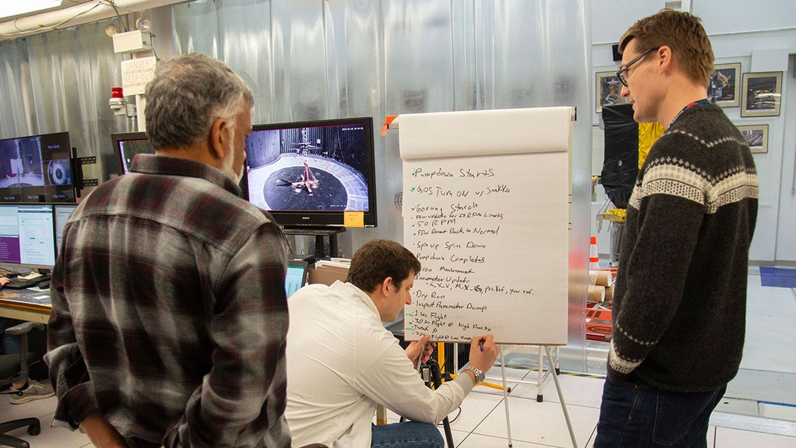 Bob Balaram, Teddy Tzanetos and Havard Grip from the NASA Mars Helicopter project discuss test results.