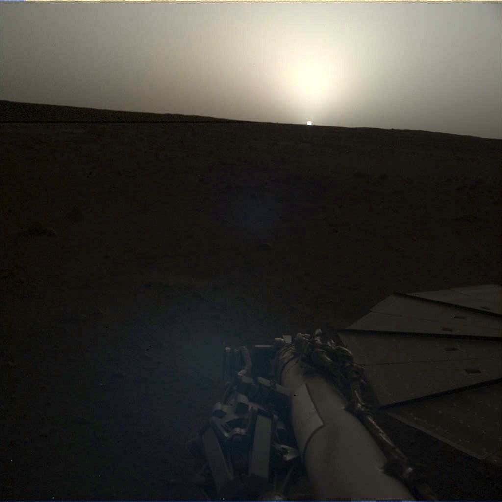 NASA's InSight lander used the Instrument Deployment Camera (IDC) on the end of its robotic arm to image this sunset on Mars on April 25, 2019, the 145th Martian day, or sol, of the mission. This was taken around 6:30 p.m. Mars local time.