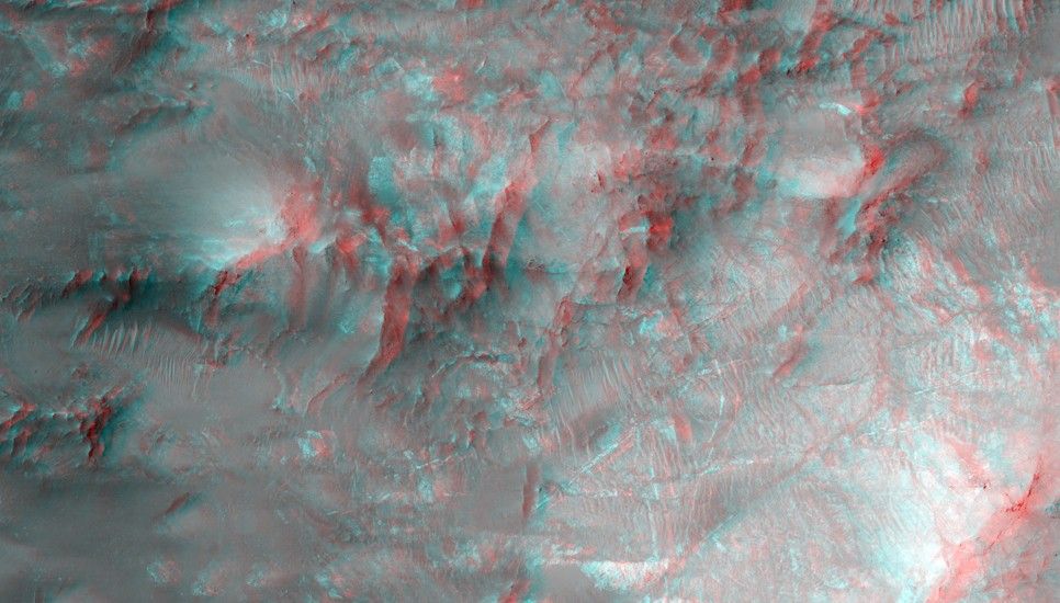 The bright linear features cutting the bedrock in the center region of this image look like mineral veins.