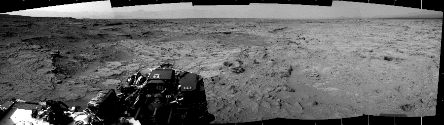 NASA's Mars rover Curiosity took 5 images in Gale Crater using its mast-mounted Left Navigation Camera (Navcam) to create this mosaic. The seam-corrected mosaic provides a 167-degree cylindrical projection panorama of the Martian surface centered at 15 degrees azimuth (measured clockwise from north). Curiosity took the images on November 28, 2012, Sol 111 of the Mars Science Laboratory mission at drive 432, site number 5. The local mean solar time for the image exposures was 3 PM. Each Navcam image has a 45 degree field of view. CREDIT: NASA/JPL-Caltech