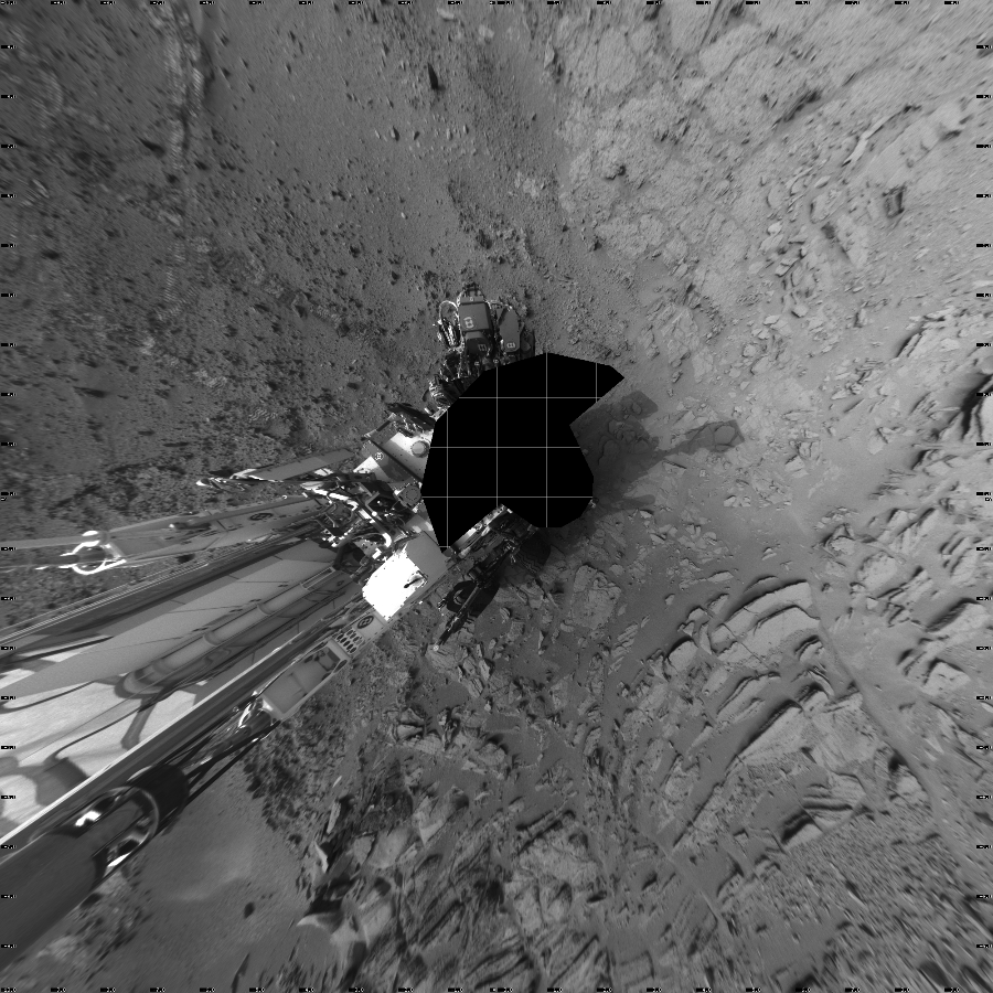 NASA's Mars rover Curiosity took 18 images in Gale Crater using its mast-mounted Left Navigation Camera (Navcam) to create this mosaic. The seam-corrected mosaic provides a vertical projection of the Martian surface near the rover, covering an area of 20 meters (north/south) by 20 meters (east/west). North is up in the image. This projection provides an overhead view, but introduces distortion for items not on the surface, such as large rocks and the rover itself.  Curiosity took the images on December 08, 2012, Sol 120 of the Mars Science Laboratory mission at drive 742, site number 5. The local mean solar time for the image exposures was from 3 PM to 4 PM. Each Navcam image has a 45-degree field of view. CREDIT: NASA/JPL-Caltech