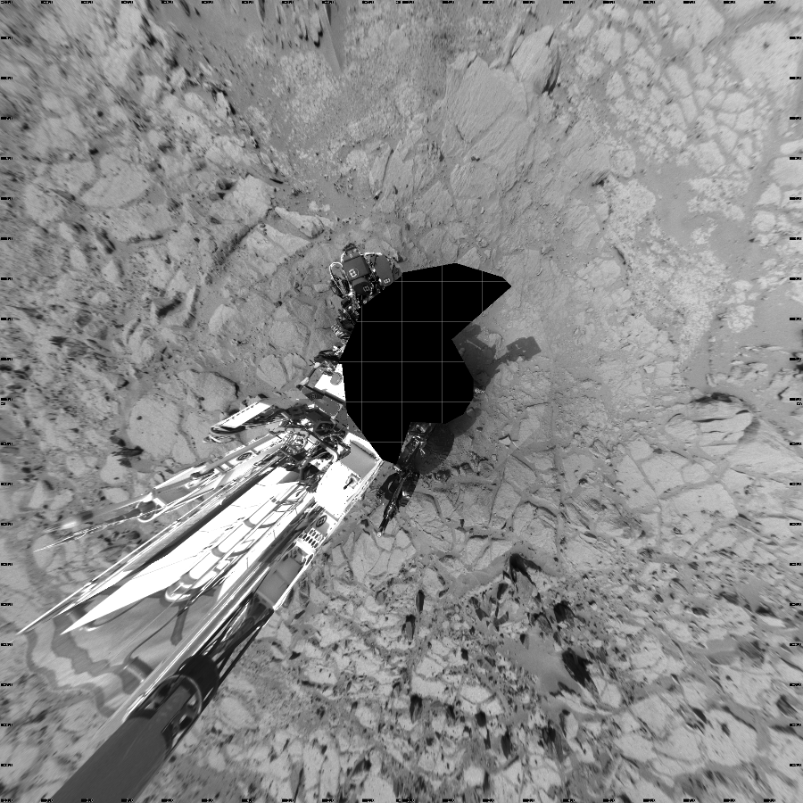 NASA's Mars rover Curiosity took 17 images in Gale Crater using its mast-mounted Left Navigation Camera (Navcam) to create this mosaic. The seam-corrected mosaic provides a vertical projection of the Martian surface near the rover, covering an area of 20 meters (north/south) by 20 meters (east/west). North is up in the image. This projection provides an overhead view, but introduces distortion for items not on the surface, such as large rocks and the rover itself.  Curiosity took the images on December 12, 2012, Sols 125-124 of the Mars Science Laboratory mission at drive 1216, site number 5. The local mean solar time for the image exposures was from 11 AM to 2 PM. Each Navcam image has a 45-degree field of view. CREDIT: NASA/JPL-Caltech