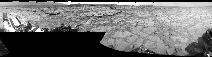NASA's Mars rover Curiosity took 17 images in Gale Crater using its mast-mounted Left Navigation Camera (Navcam) to create this mosaic. The seam-corrected mosaic provides a 360-degree cylindrical-perspective projection panorama of the Martian surface suitable for stereo viewing, centered at 0 degrees azimuth (measured clockwise from north). This single-eye view must be combined with the partner right image to be viewed in stereo. Curiosity took the images on December 13, 2012, Sol 125 of the Mars Science Laboratory mission at drive 1398, site number 5. The local mean solar time for the image exposures was 2 PM. Each Navcam image has a 45-degree field of view. CREDIT: NASA/JPL-Caltech