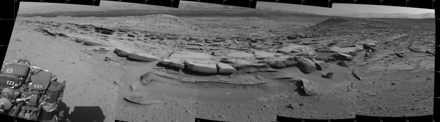 NASA's Mars rover Curiosity took 5 images in Gale Crater using its mast-mounted Left Navigation Camera (Navcam) to create this mosaic. The seam-corrected mosaic provides a 169-degree cylindrical projection panorama of the Martian surface centered at 179 degrees azimuth (measured clockwise from north). Curiosity took the images on March 19, 2014, Sol 574 of the Mars Science Laboratory mission at drive 740, site number 30. The local mean solar time for the image exposures was 3 PM. Each Navcam image has a 45 degree field of view. CREDIT: NASA/JPL-Caltech