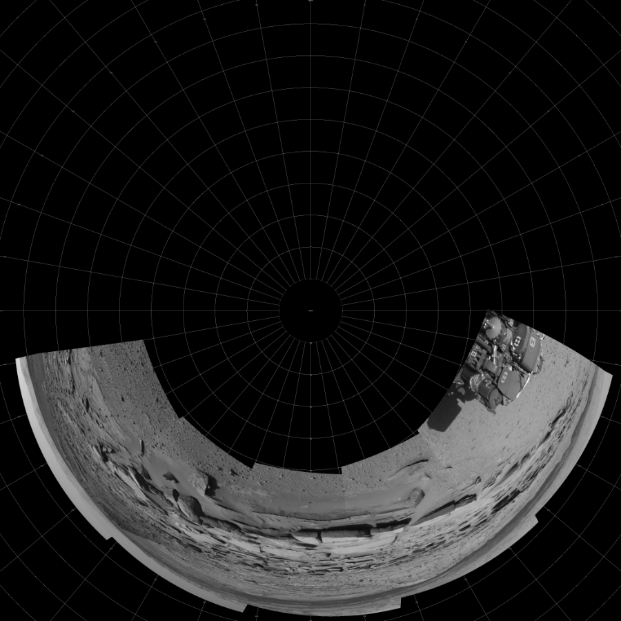 NASA's Mars rover Curiosity took 5 images in Gale Crater using its mast-mounted Left Navigation Camera (Navcam) to create this mosaic. The seam-corrected mosaic provides a polar stereographic projection panorama of the Martian surface with 0 degrees azimuth (measured clockwise from north) at the top of the image. Curiosity took the images on March 19, 2014, Sol 574 of the Mars Science Laboratory mission at drive 740, site number 30. The local mean solar time for the image exposures was 3 PM. Each Navcam image has a 45-degree field of view. CREDIT: NASA/JPL-Caltech