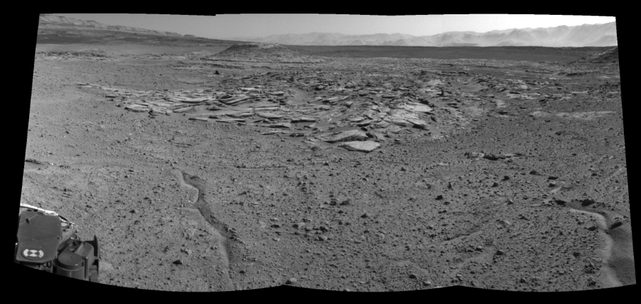 NASA's Mars rover Curiosity took 3 images in Gale Crater using its mast-mounted Left Navigation Camera (Navcam) to create this mosaic. The seam-corrected mosaic provides a 109-degree cylindrical-perspective projection panorama of the Martian surface suitable for stereo viewing, centered at 349 degrees azimuth (measured clockwise from north). This single-eye view must be combined with the partner right image to be viewed in stereo.  Curiosity took the images on April 03, 2014, Sol 589 of the Mars Science Laboratory mission at drive 0, site number 31. The local mean solar time for the image exposures was 2 PM. Each Navcam image has a 45-degree field of view. CREDIT: NASA/JPL-Caltech
