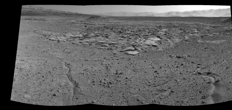 NASA's Mars rover Curiosity took 3 images in Gale Crater using its mast-mounted Right Navigation Camera (Navcam) to create this mosaic. The seam-corrected mosaic provides a 109-degree cylindrical-perspective projection panorama of the Martian surface suitable for stereo viewing, centered at 346 degrees azimuth (measured clockwise from north). This single-eye view must be combined with the partner left image to be viewed in stereo. Curiosity took the images on April 03, 2014, Sol 589 of the Mars Science Laboratory mission at drive 0, site number 31. The local mean solar time for the image exposures was 2 PM. Each Navcam image has a 45-degree field of view. CREDIT: NASA/JPL-Caltech