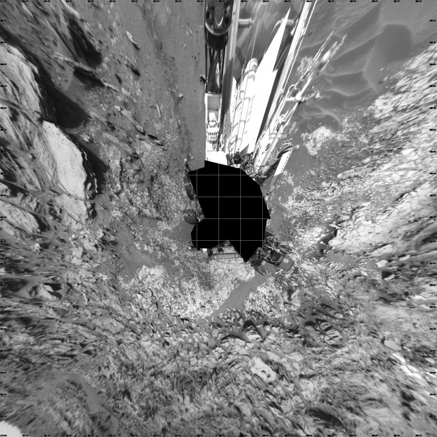 NASA's Mars rover Curiosity took 27 images in Gale Crater using its mast-mounted Left Navigation Camera (Navcam) to create this mosaic. The seam-corrected mosaic provides a vertical projection of the Martian surface near the rover, covering an area of 20 meters (north/south) by 20 meters (east/west). North is up in the image. This projection provides an overhead view, but introduces distortion for items not on the surface, such as large rocks and the rover itself.  Curiosity took the images on May 26, 2015, Sol 995 of the Mars Science Laboratory mission at drive 1530, site number 48. The local mean solar time for the image exposures was 2 PM. Each Navcam image has a 45-degree field of view. CREDIT: NASA/JPL-Caltech