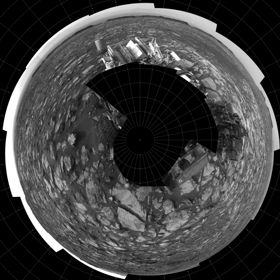 NASA's Mars rover Curiosity took 18 images in Gale Crater using its mast-mounted Left Navigation Camera (Navcam) to create this mosaic. The seam-corrected mosaic provides a polar stereographic projection panorama of the Martian surface with 0 degrees azimuth (measured clockwise from north) at the top of the image. Curiosity took the images on October 07, 2016, Sols 1482-1483 of the Mars Science Laboratory mission at drive 1572, site number 58. The local mean solar time for the image exposures was from 2 PM to 4 PM. Each Navcam image has a 45-degree field of view. CREDIT: NASA/JPL-Caltech