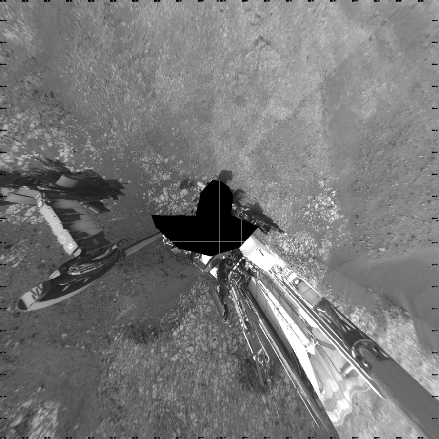 NASA's Mars rover Curiosity took 21 images in Gale Crater using its mast-mounted Left Navigation Camera (Navcam) to create this mosaic. The seam-corrected mosaic provides a vertical projection of the Martian surface near the rover, covering an area of 20 meters (north/south) by 20 meters (east/west). North is up in the image. This projection provides an overhead view, but introduces distortion for items not on the surface, such as large rocks and the rover itself.  Curiosity took the images on October 29, 2018, Sols 2214-2218 of the Mars Science Laboratory mission at drive 0, site number 73. The local mean solar time for the image exposures was from 2 PM to 4 PM. Each Navcam image has a 45-degree field of view. CREDIT: NASA/JPL-Caltech