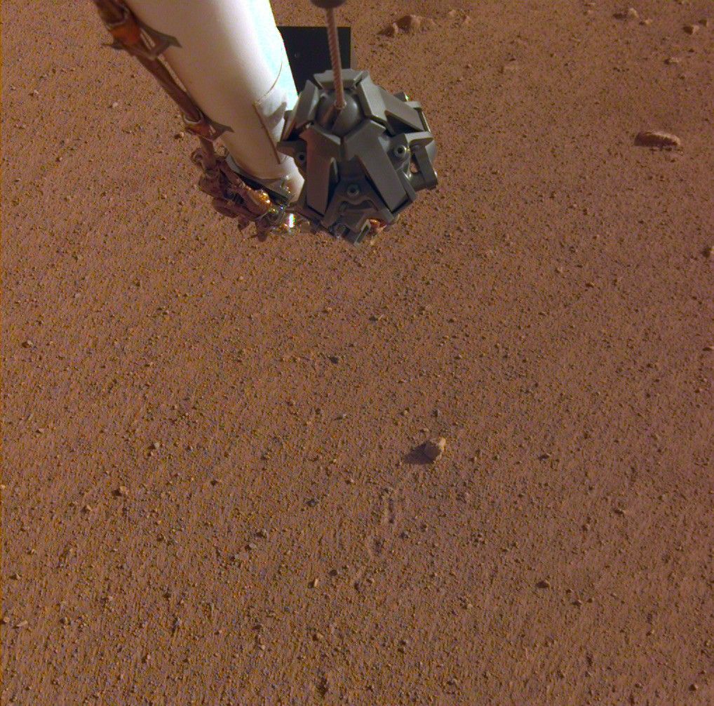 The rock in the center of this image was tossed about 3 feet (1 meter) by NASA's InSight spacecraft as it touched down on Mars on November 26, 2018. The rock, which is a little bigger than a golf ball, was later nicknamed "Rolling Stones Rock" in honor of The Rolling Stones.