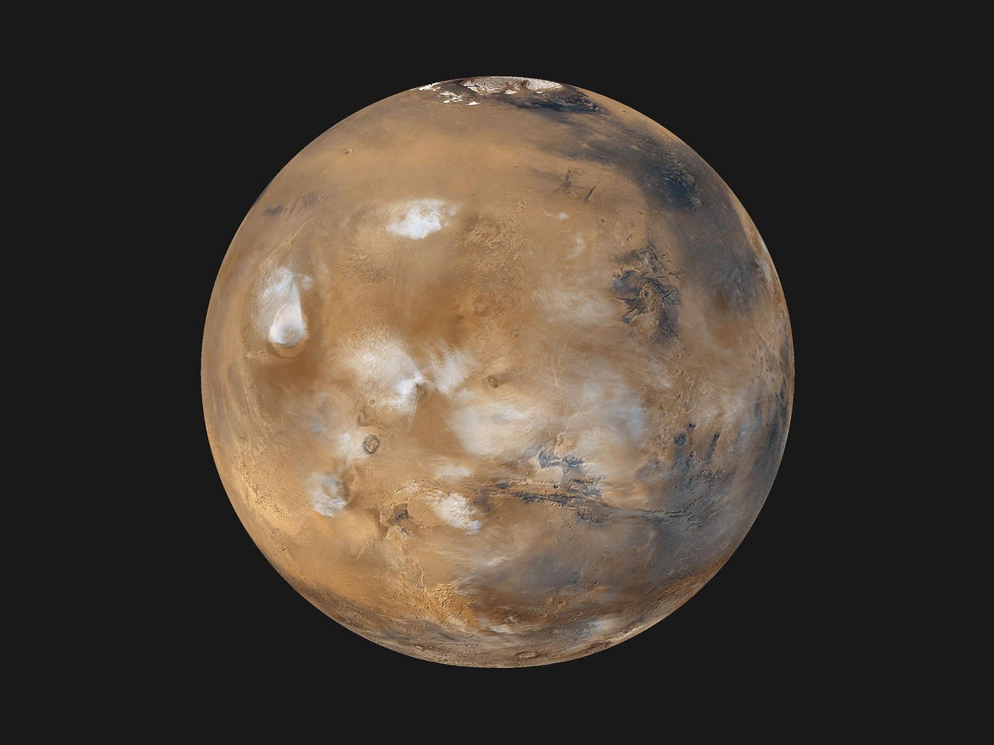 This image provides a global "snapshot" of weather patterns across the planet. Here, bluish-white water ice clouds hang above the Tharsis volcanoes.