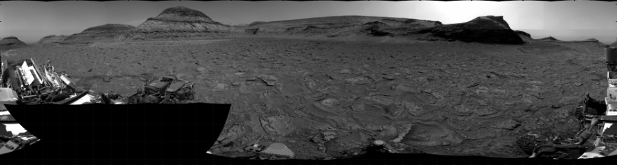 NASA's Mars rover Curiosity took 31 images in Gale Crater using its mast-mounted Right Navigation Camera (Navcam) to create this mosaic. The seam-corrected mosaic provides a 360-degree cylindrical projection panorama of the Martian surface centered at 195 degrees azimuth (measured clockwise from north). Curiosity took the images on January 18, 2023, Sol 3715 of the Mars Science Laboratory mission at drive 1676, site number 99. The local mean solar time for the image exposures was from 2 PM to 4 PM. Each Navcam image has a 45 degree field of view. CREDIT: NASA/JPL-Caltech