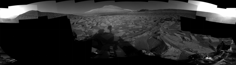 NASA's Mars rover Curiosity took 24 images in Gale Crater using its mast-mounted Right Navigation Camera (Navcam) to create this mosaic. The seam-corrected mosaic provides a 360-degree cylindrical projection panorama of the Martian surface centered at 129 degrees azimuth (measured clockwise from north). Curiosity took the images on June 28, 2023, Sol 3871 of the Mars Science Laboratory mission at drive 390, site number 102. The local mean solar time for the image exposures was from 4 PM to 5 PM. Each Navcam image has a 45 degree field of view. CREDIT: NASA/JPL-Caltech