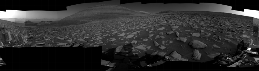 NASA's Mars rover Curiosity took 31 images in Gale Crater using its mast-mounted Right Navigation Camera (Navcam) to create this mosaic. The seam-corrected mosaic provides a 360-degree cylindrical projection panorama of the Martian surface centered at 123 degrees azimuth (measured clockwise from north). Curiosity took the images on September 22, 2023, Sol 3955 of the Mars Science Laboratory mission at drive 892, site number 104. The local mean solar time for the image exposures was from 2 PM to 3 PM. Each Navcam image has a 45 degree field of view. CREDIT: NASA/JPL-Caltech