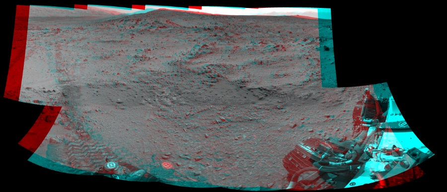 NASA's Mars rover Curiosity took 10 image pairs in Gale Crater using its mast-mounted Navigation Camera (Navcam) to create this mosaic. The seam-corrected mosaic provides a 232-degree cylindrical perspective projection panorama of the Martian surface suitable for stereo viewing, centered at 94 degrees azimuth (measured clockwise from north). This anaglyph must be viewed with red/blue glasses (red over left eye).  Curiosity took the images on July 05, 2013, Sol 324 of the Mars Science Laboratory mission at drive 0, site number 7. The local mean solar time for the image exposures was 3 PM. Each Navcam image has a 45-degree field of view. CREDIT: NASA/JPL-Caltech