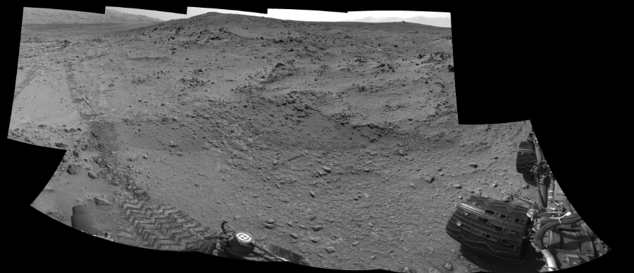 NASA's Mars rover Curiosity took 10 images in Gale Crater using its mast-mounted Left Navigation Camera (Navcam) to create this mosaic. The seam-corrected mosaic provides a 232-degree cylindrical-perspective projection panorama of the Martian surface suitable for stereo viewing, centered at 94 degrees azimuth (measured clockwise from north). This single-eye view must be combined with the partner right image to be viewed in stereo.  Curiosity took the images on July 05, 2013, Sol 324 of the Mars Science Laboratory mission at drive 0, site number 7. The local mean solar time for the image exposures was 3 PM. Each Navcam image has a 45-degree field of view. CREDIT: NASA/JPL-Caltech