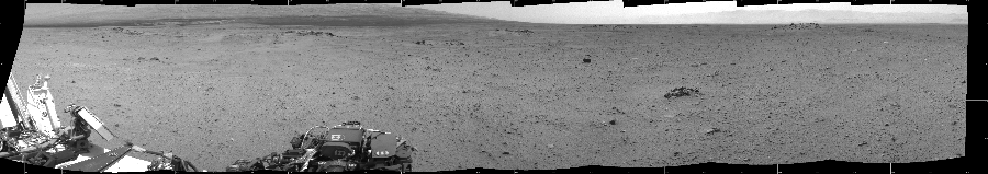 NASA's Mars rover Curiosity took 8 images in Gale Crater using its mast-mounted Left Navigation Camera (Navcam) to create this mosaic. The seam-corrected mosaic provides a 262-degree cylindrical projection panorama of the Martian surface centered at 215 degrees azimuth (measured clockwise from north). Curiosity took the images on July 26, 2013, Sol 344 of the Mars Science Laboratory mission at drive 0, site number 10. The local mean solar time for the image exposures was from 2 PM to 3 PM. Each Navcam image has a 45 degree field of view. CREDIT: NASA/JPL-Caltech